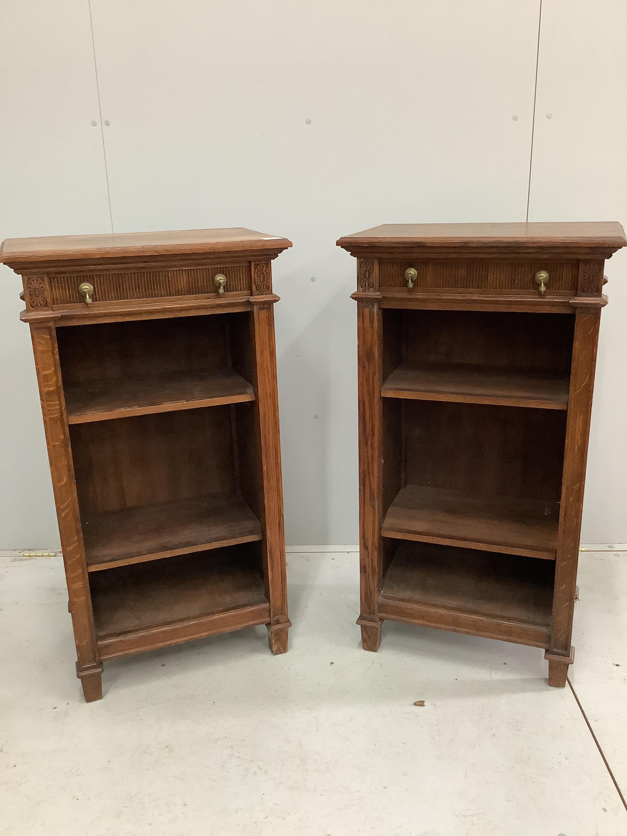 A pair of early 20th century oak open bookcases, width 58cm, depth 38cm, height 107cm